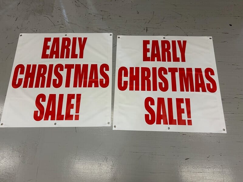 An image of "Early Christmas Sale" signs.